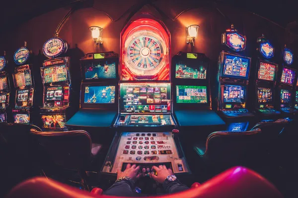 GOOD111 Casino Games — Enjoy nonstop entertainment A close-up shot of golden coins falling around a spinning roulette wheel, representing immersive casino action at GOOD111.